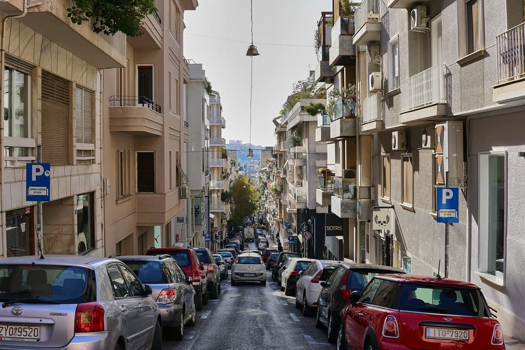 Voukourestiou Street in Kolonaki with the Acropolis in the distance