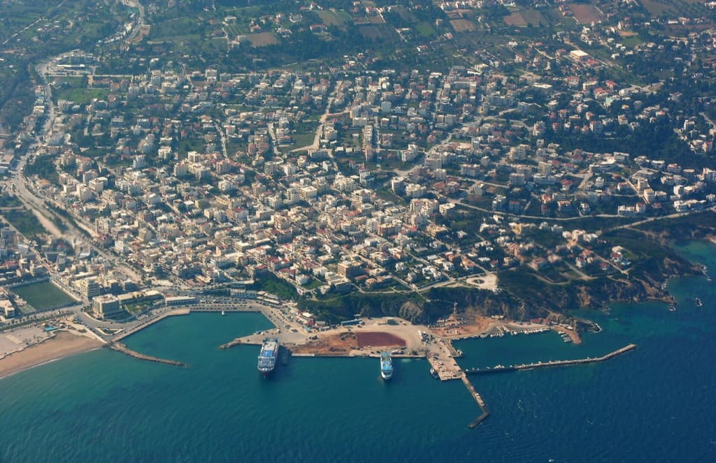 Aerial view of Rafina harbour, with ferries at the quay and the town immediately behind.