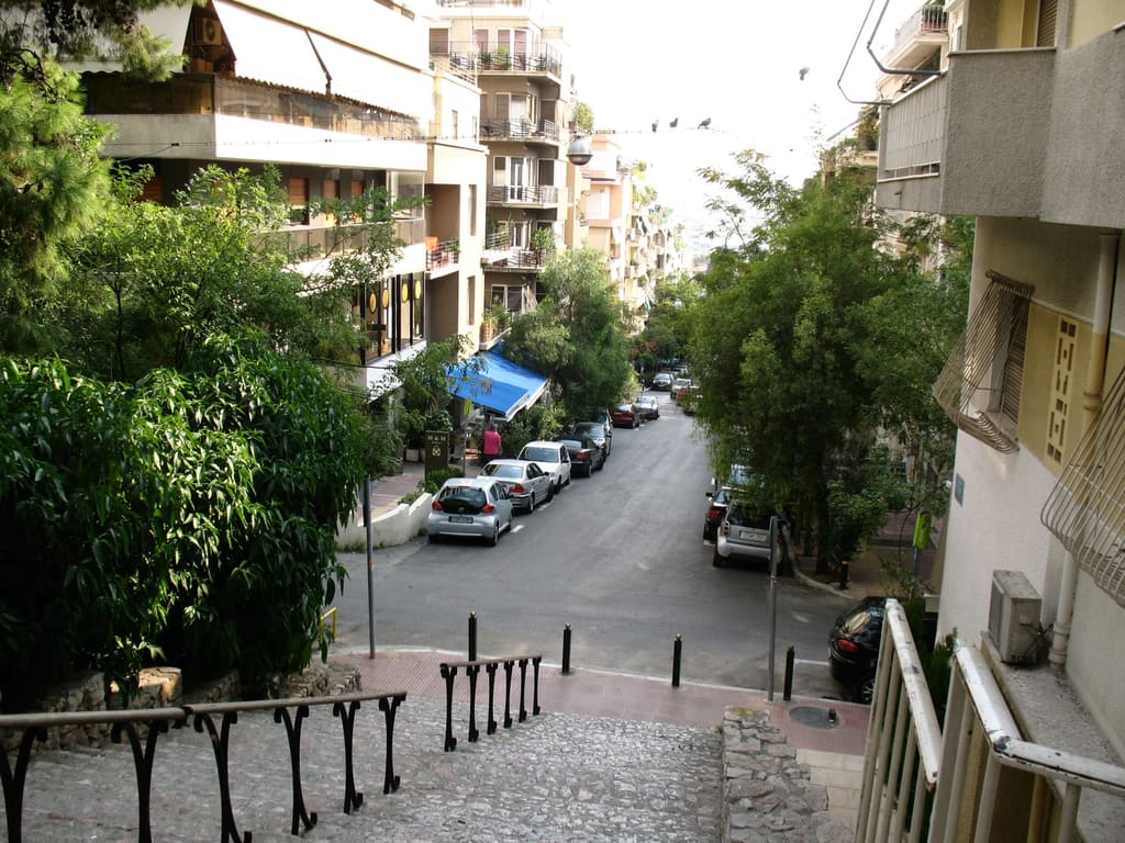 A leafy Kolonaki street sloping downhill in the upscale central Athens district